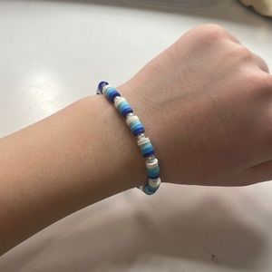 Different colored blue and white clay bead bracelet handmaid